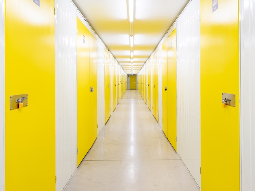 Clean climate-controlled storage unit interior with boxes